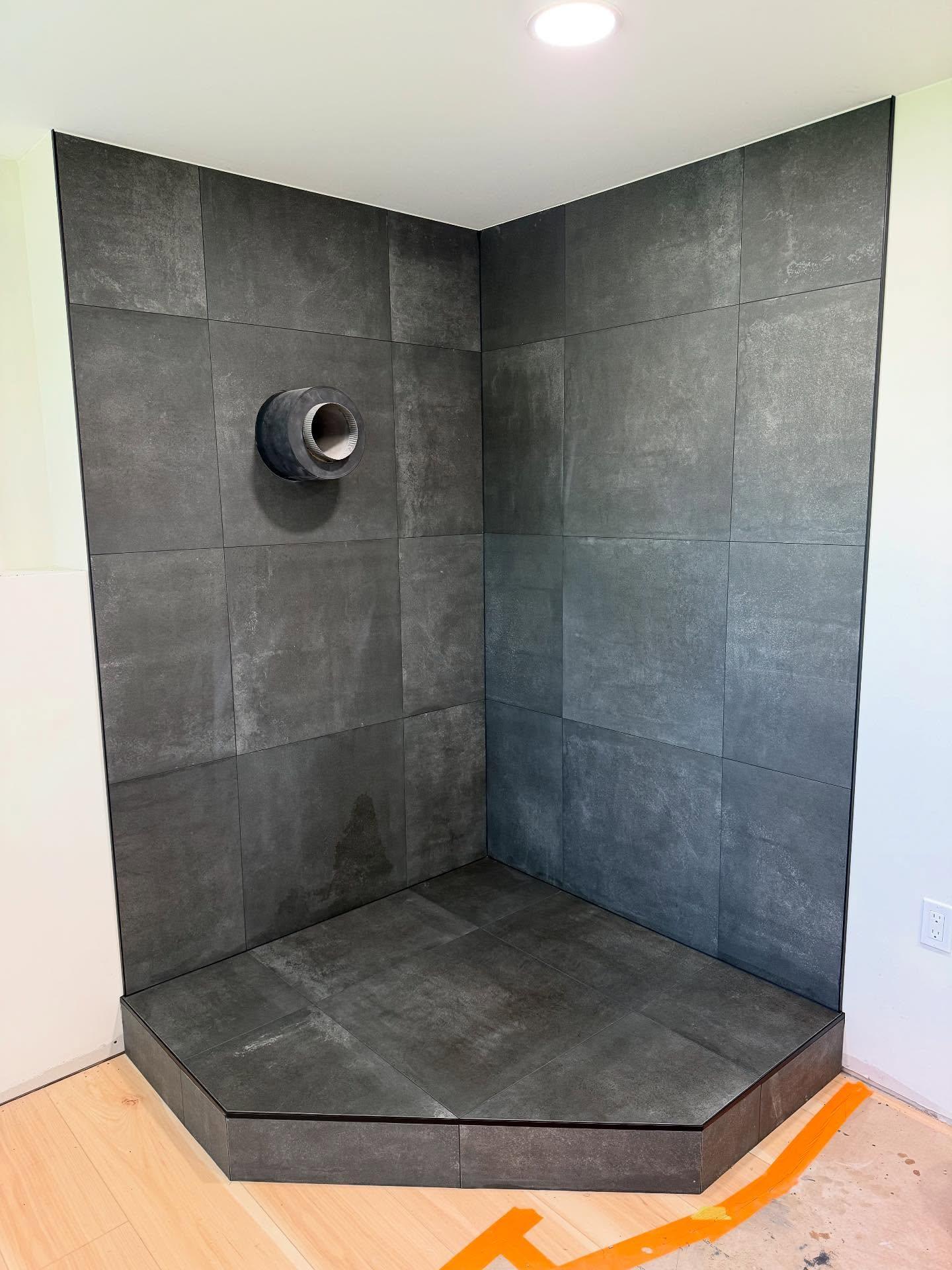Charcoal large-format tile accent wall